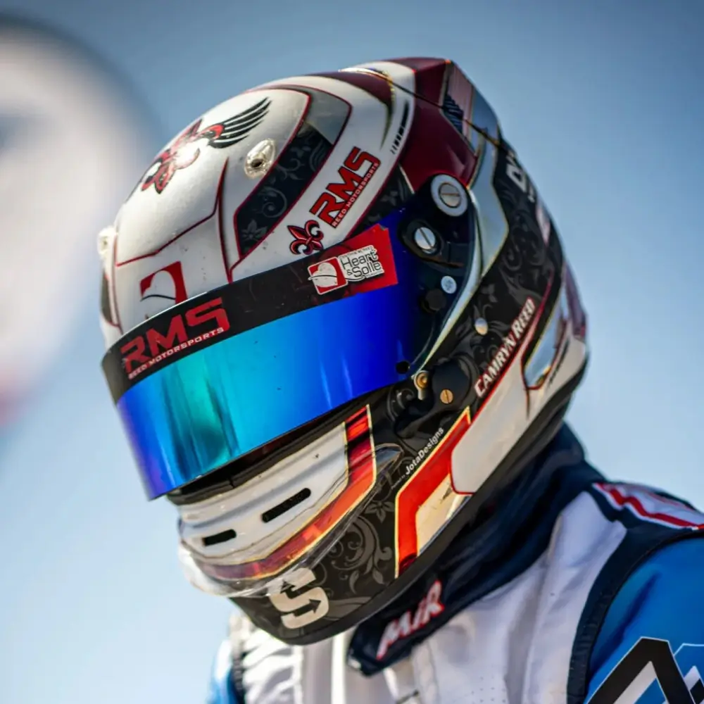 Headshot of Racing Driver, Camryn Reed, Who Is In Her Karting Suit and Helmet.
