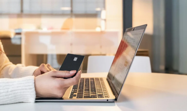 A Woman Gets Ready to Input Her Payment Information to Buy a Product On a Converting Website.