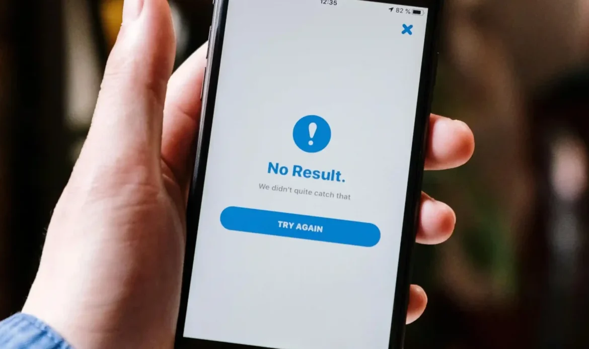 A Man Holds A Phone Screen With An Error Code From A Website, Showcasing The Need for A Business's Website To Be Live and Working.
