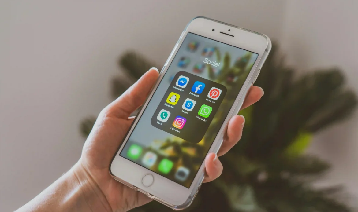 An EnforceMG Employee Looks At a Grid of Social Media Apps That They Will Manage for Their Client.
