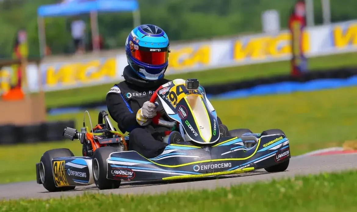 Owner of EnforceMG, Keegan Widmyer, Races Up the Hill in His 2023, EnforceMG Sponsored Tony Kart at the 2023 CKNA Regional Race at Pitt Race.